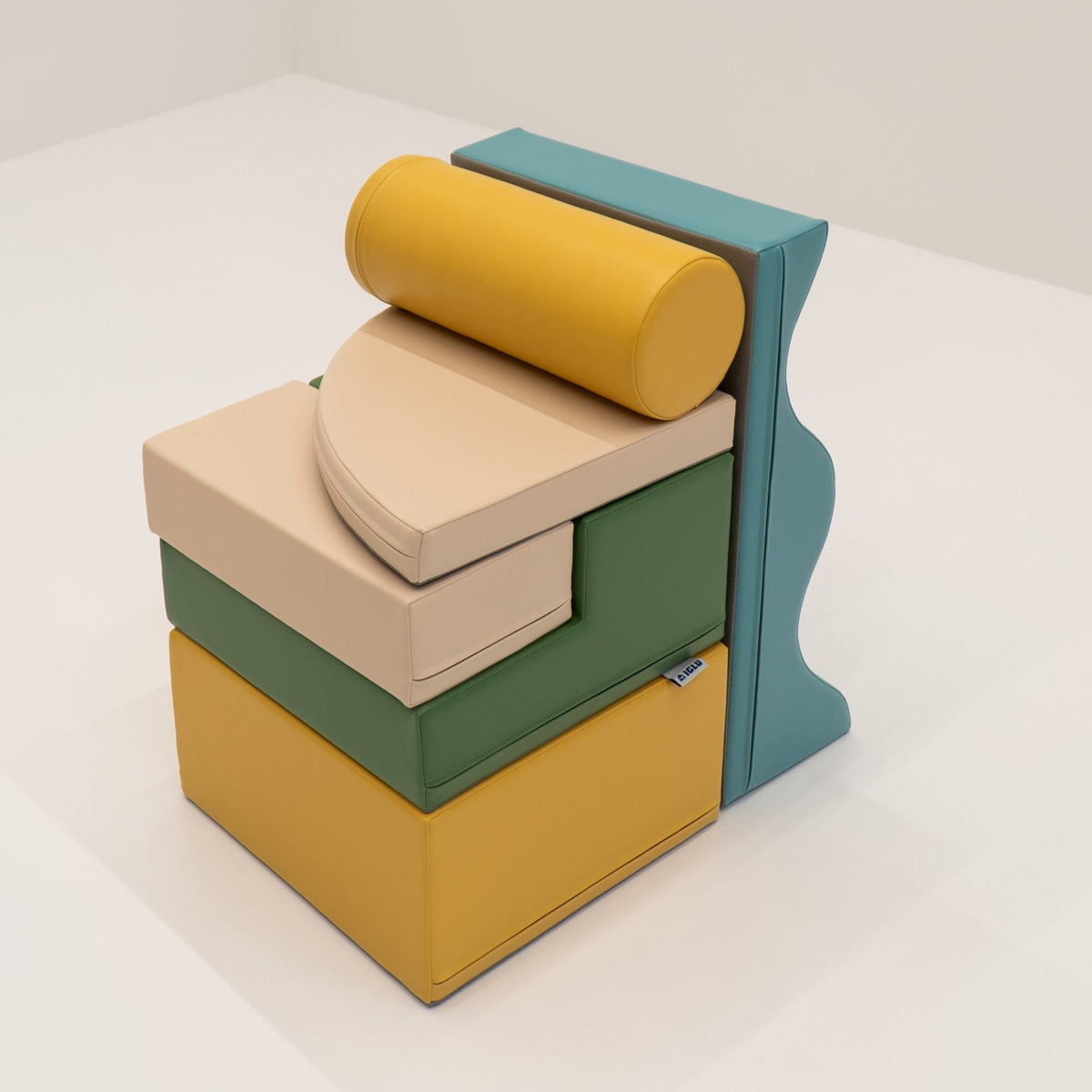 19. Stacked IGLU Explorer Set with pastel turquoise, yellow, and green foam blocks in a compact arrangement