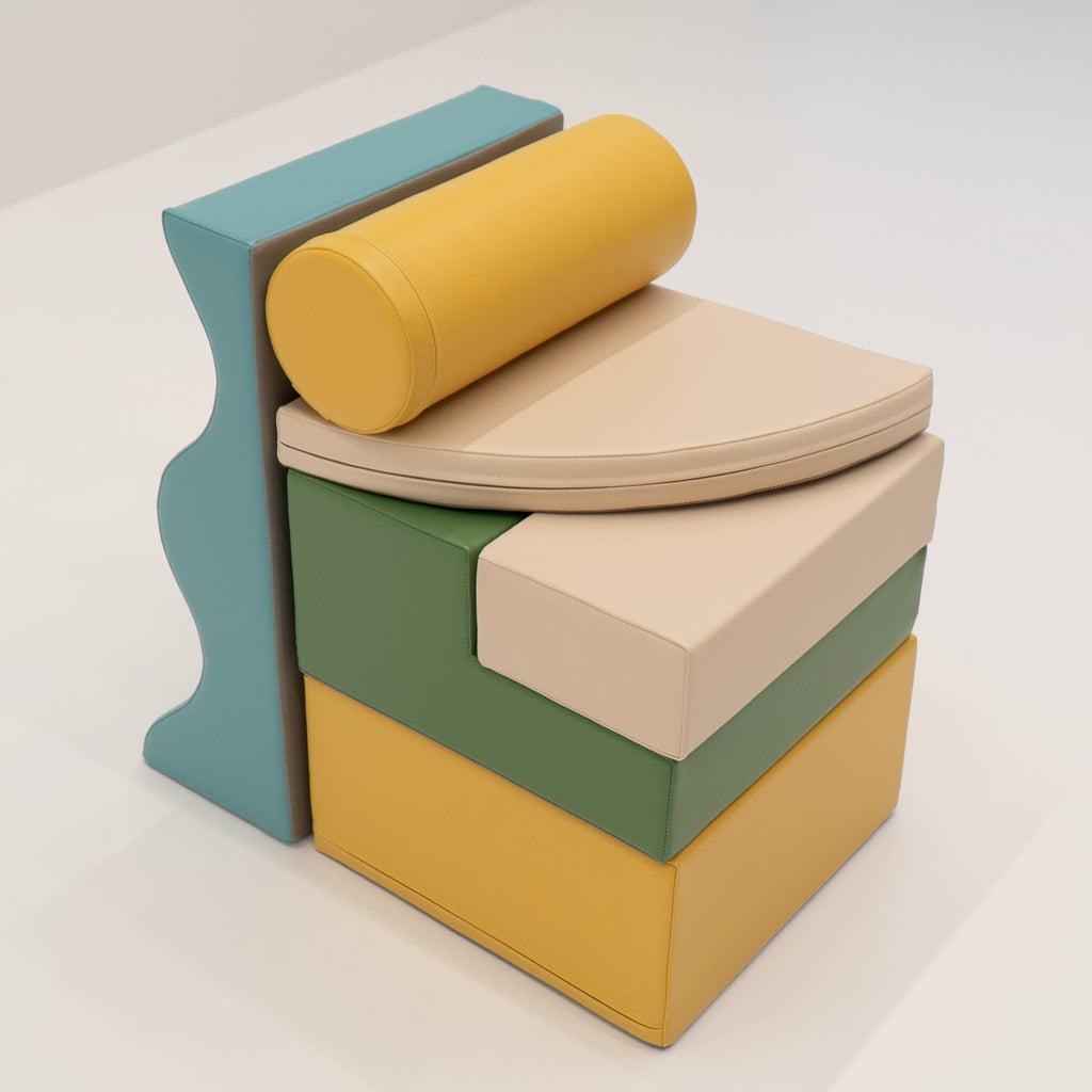 18. Stacked IGLU Explorer Set with pastel turquoise, yellow, and green foam blocks in a compact arrangement