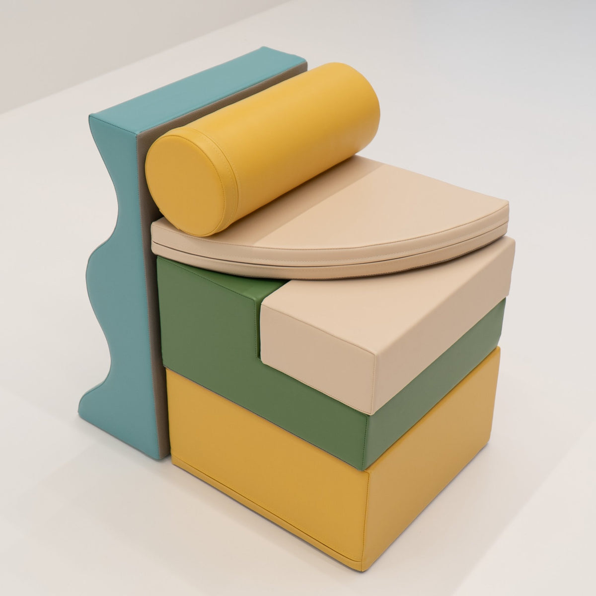 18. Stacked IGLU Explorer Set with pastel turquoise, yellow, and green foam blocks in a compact arrangement