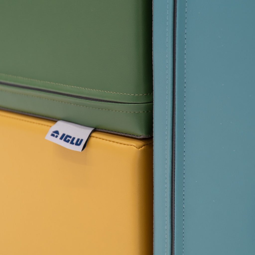 20. Close-up of IGLU Explorer Set showing brand tag on pastel turquoise and yellow foam blocks