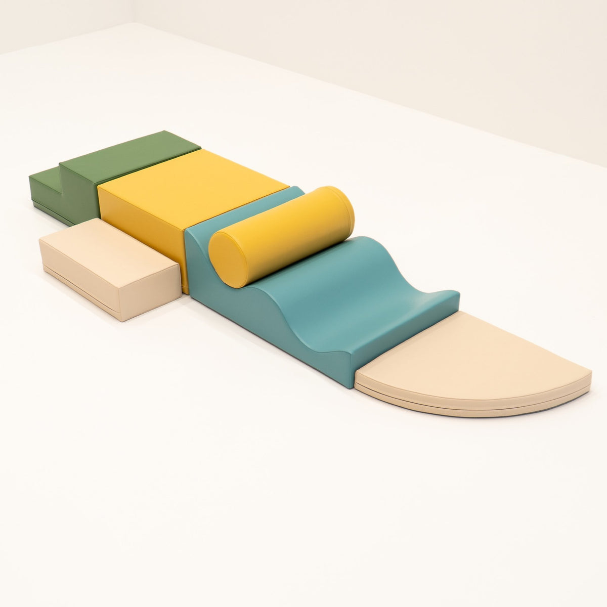 28. IGLU Explorer Set with pastel turquoise, yellow, and green foam blocks arranged in a line