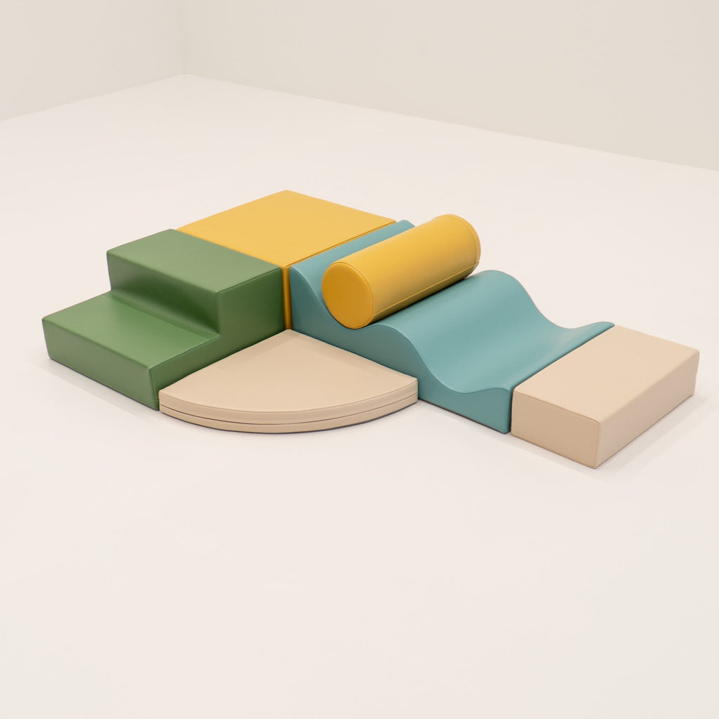 10. IGLU Explorer Set with pastel turquoise, yellow, and green foam blocks arranged in a play structure