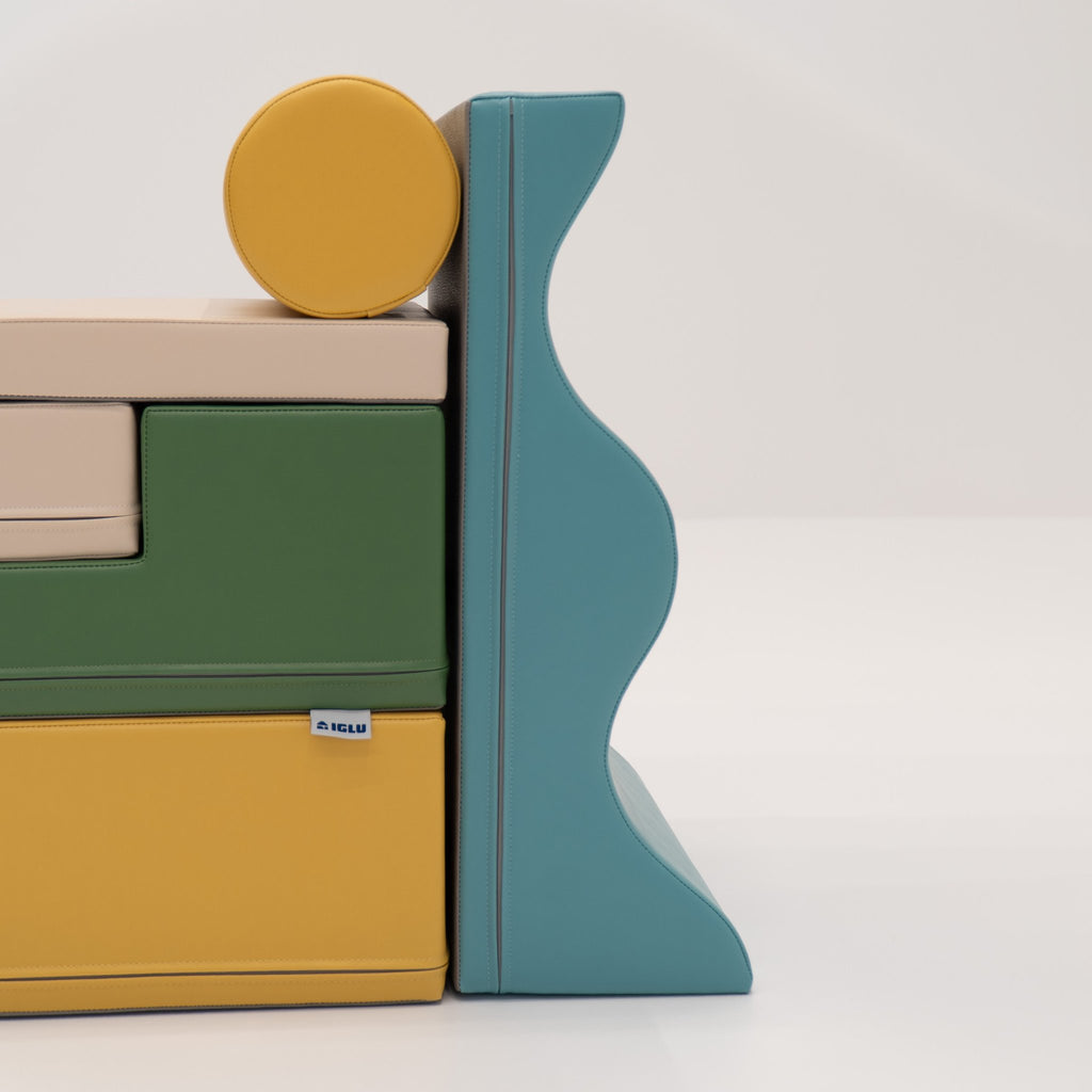 24. Side view of stacked IGLU Explorer Set with pastel turquoise, yellow, and green foam blocks