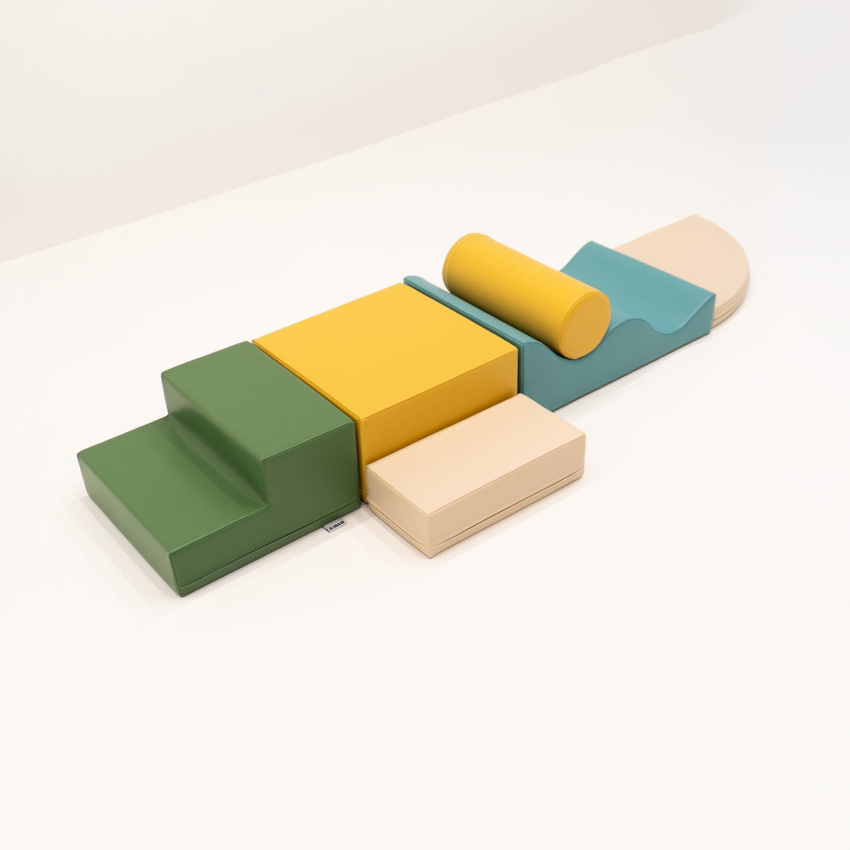 27. IGLU Explorer Set with pastel turquoise, yellow, and green foam blocks arranged in a line