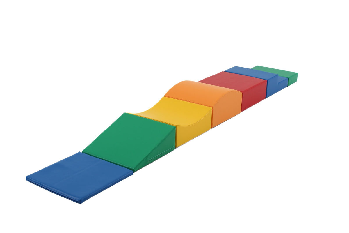 2. Studio shot of IGLU Little Crawler 7-piece foam block set in multicolor, arranged in a straight line on a white background