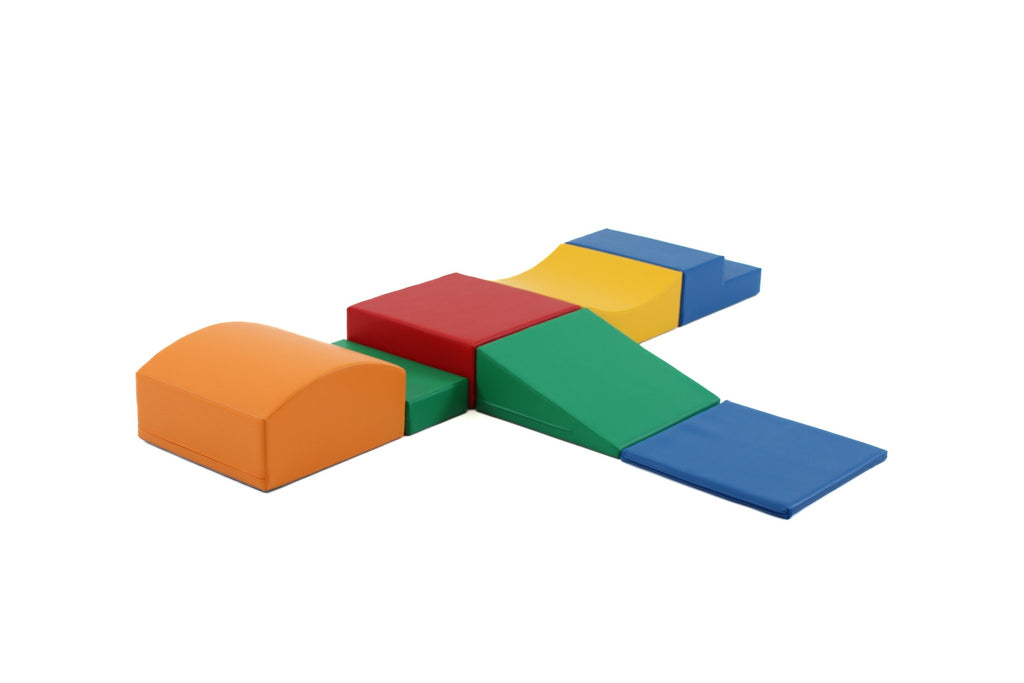 2. Studio shot of IGLU Little Crawler 7-piece foam block set in multicolor, arranged in a cross shape on a white background