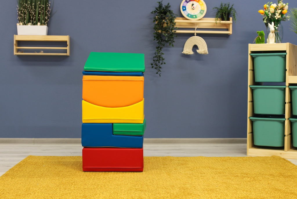 1. IGLU Little Crawler multicolor foam blocks stacked vertically in a playroom with blue wall and yellow rug