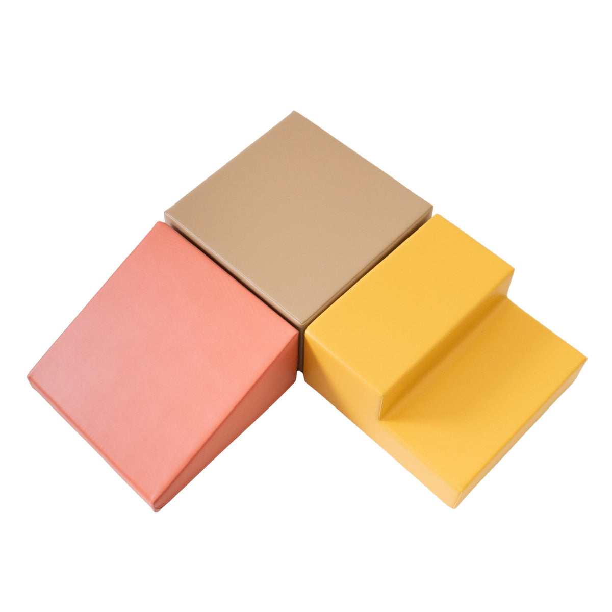 4. Flat lay of IGLU pastel pink, beige, and yellow foam blocks arranged in a triangle shape on a white background