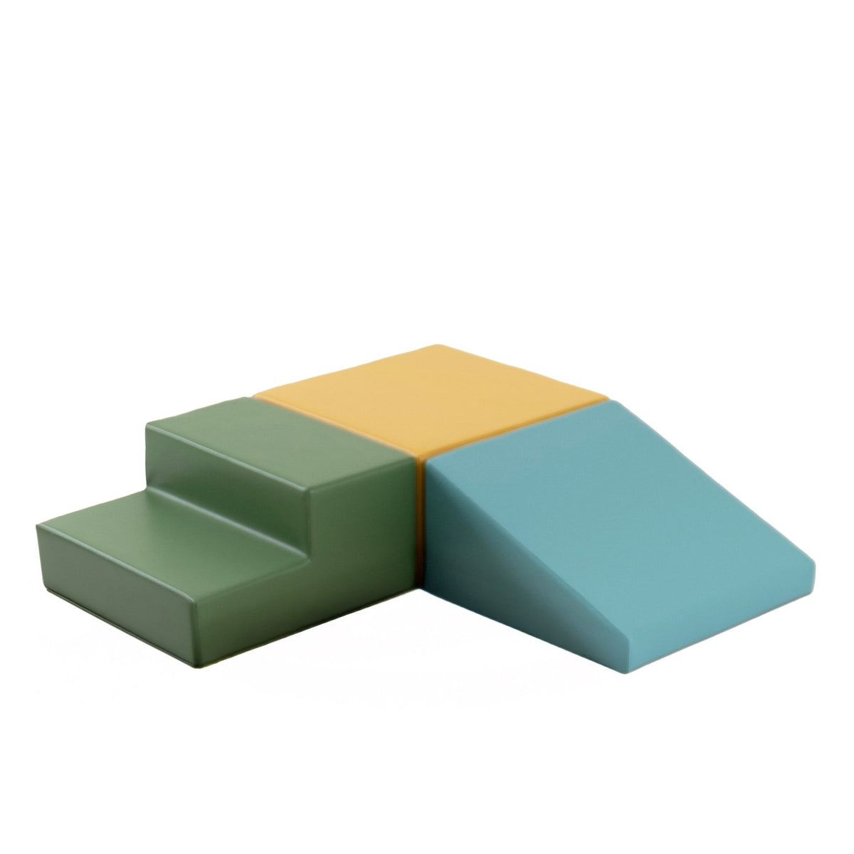 9. Studio shot of IGLU pastel turquoise, yellow, and green foam blocks arranged in a triangle