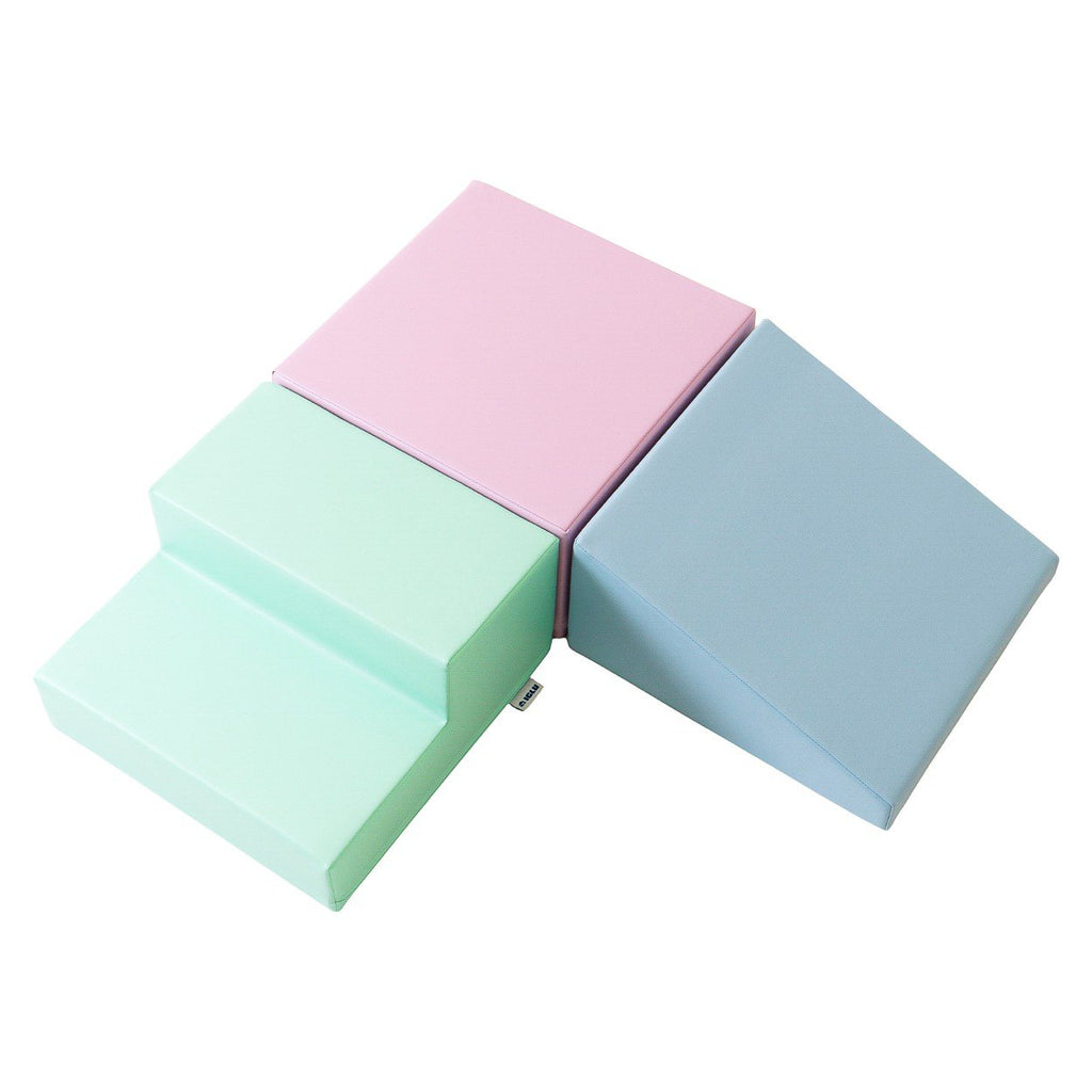 2. Soft pastel foam block set in pink, mint, and blue arranged in a step and slope design on a white background