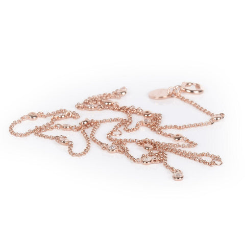 4. Close-up of MyaMoon Illumi Doubled M Necklace in rose gold, showing chain and zircons