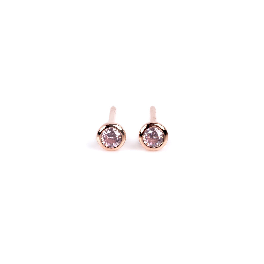 3. MyaMoon Illumi stud earrings in rose gold with pink zircon, featuring delicate Nordic elegance