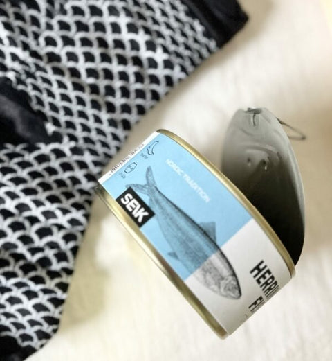 4. Close-up of SEIK Herring Socks in a Can, unisex, highlighting fish scale pattern and SEIK branding