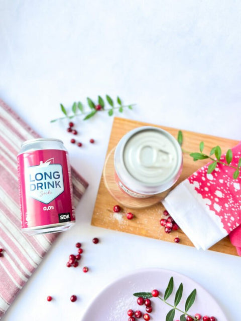 4. Top view of SEIK cranberry Long Drink Socks with can, styled with cranberries and wooden board