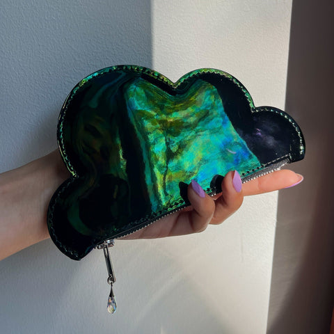 2. Iridescent Leather Cloud Purse by Tairi Roosve held in hand, showcasing Swarovski crystal zip