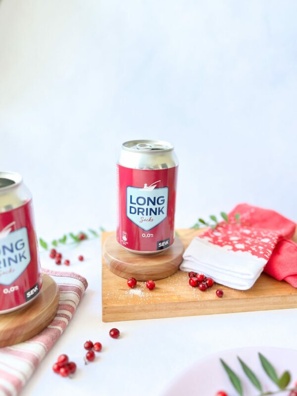 3. SEIK Long Drink Socks in cranberry with two cans, styled with cranberries and wooden board