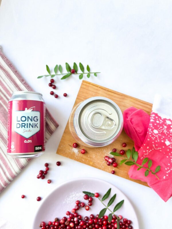 6. Top view of SEIK cranberry Long Drink Socks with can, styled with cranberries and wooden board