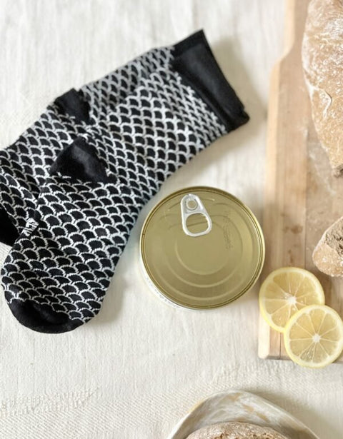 3. SEIK Herring Socks in a Can, unisex, black and white fish scale design, shown with closed can and lemon slices
