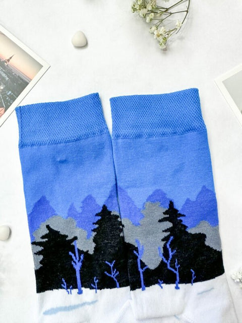 2. Flat lay of SEIK Blue-Black-White Forest socks displaying full Estonian landscape pattern