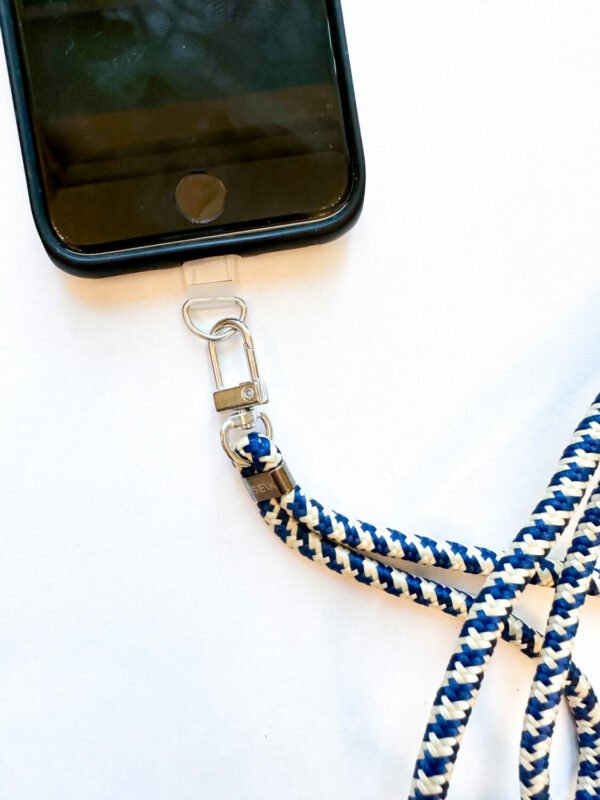5. Close-up of SEIK Universal Phone Strap in Sea Edge attached to phone case, showing clip detail