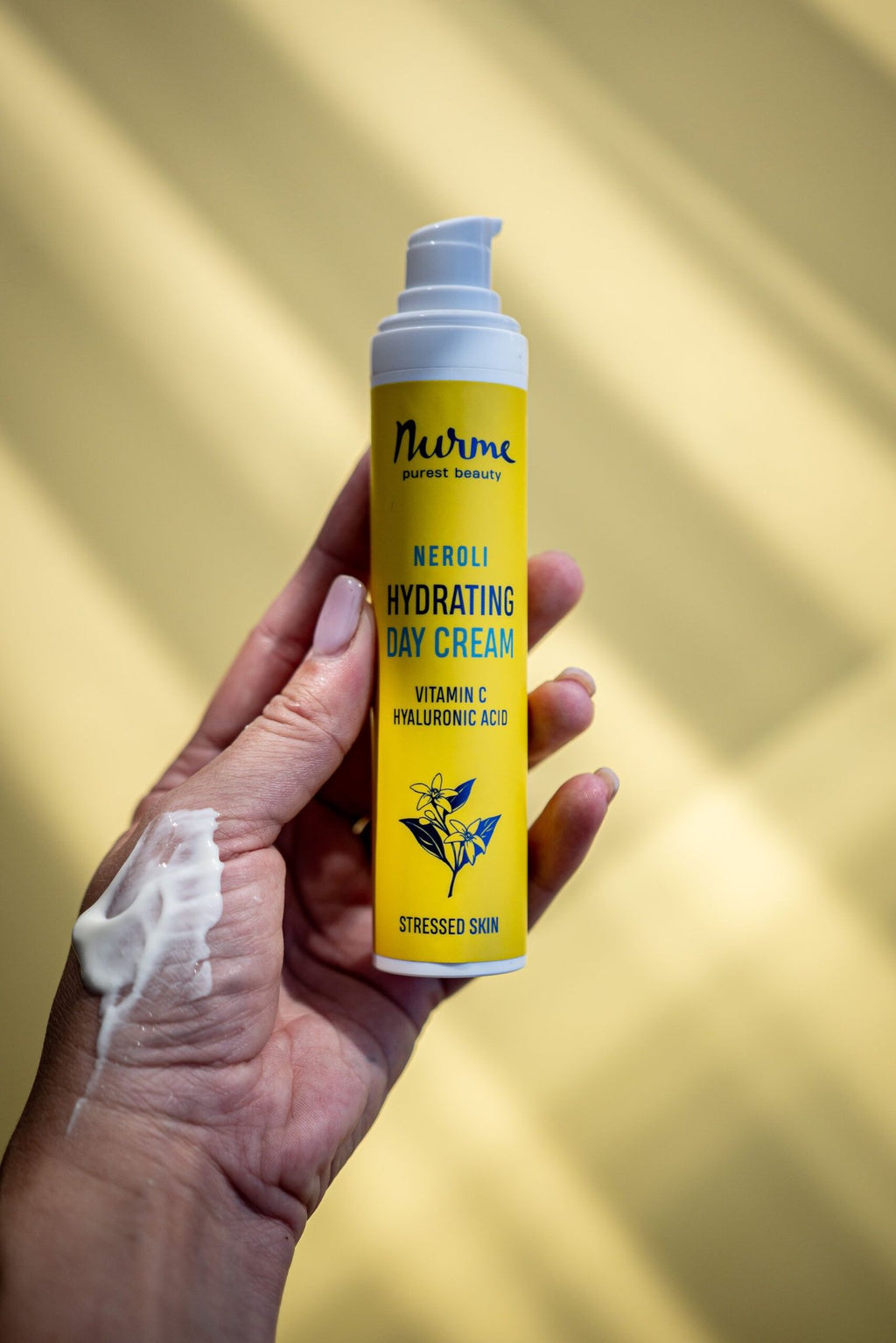 3. Close-up of Nurme hydrating day cream with cream on hand