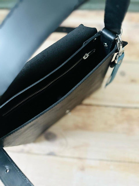 4. Interior view of eleriinseim KOKUKA crossbody leather bag highlighting hidden pocket and zippered compartment