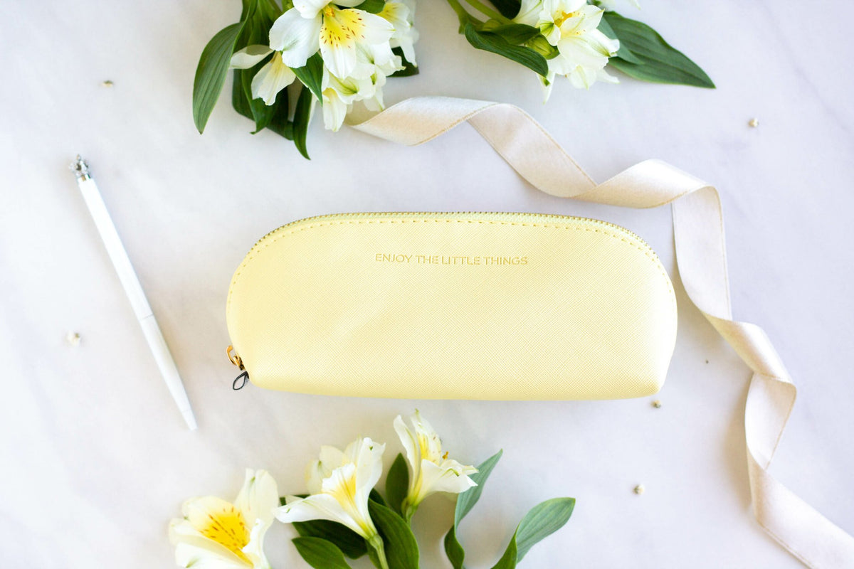 6. SEIK Pencil Case Sunshine in yellow with 'Enjoy the little things' text, styled with flowers and ribbon