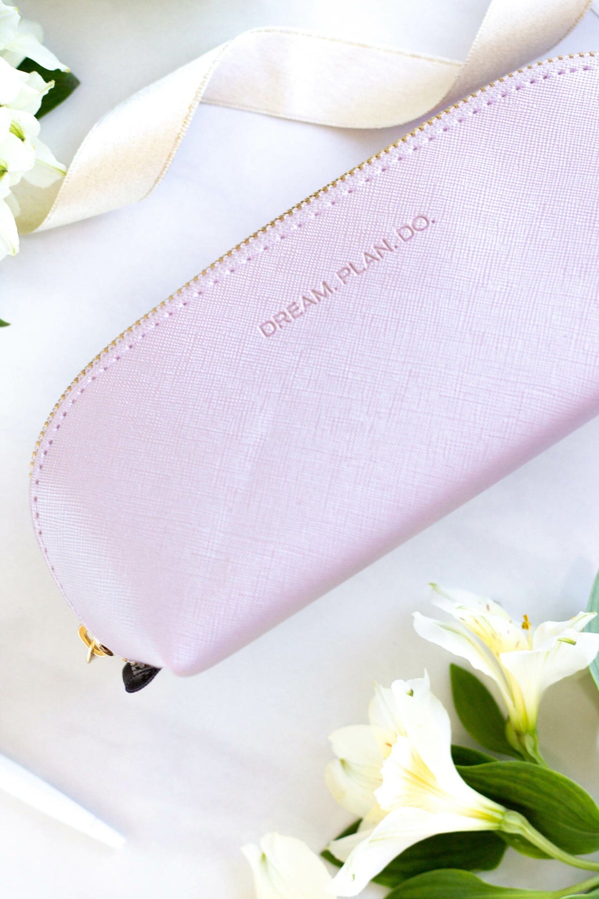 5. SEIK purple pencil case with 'DREAM. PLAN. DO.' text, styled with flowers and ribbon