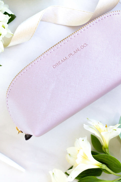 5. SEIK purple pencil case with 'DREAM. PLAN. DO.' text, styled with flowers and ribbon