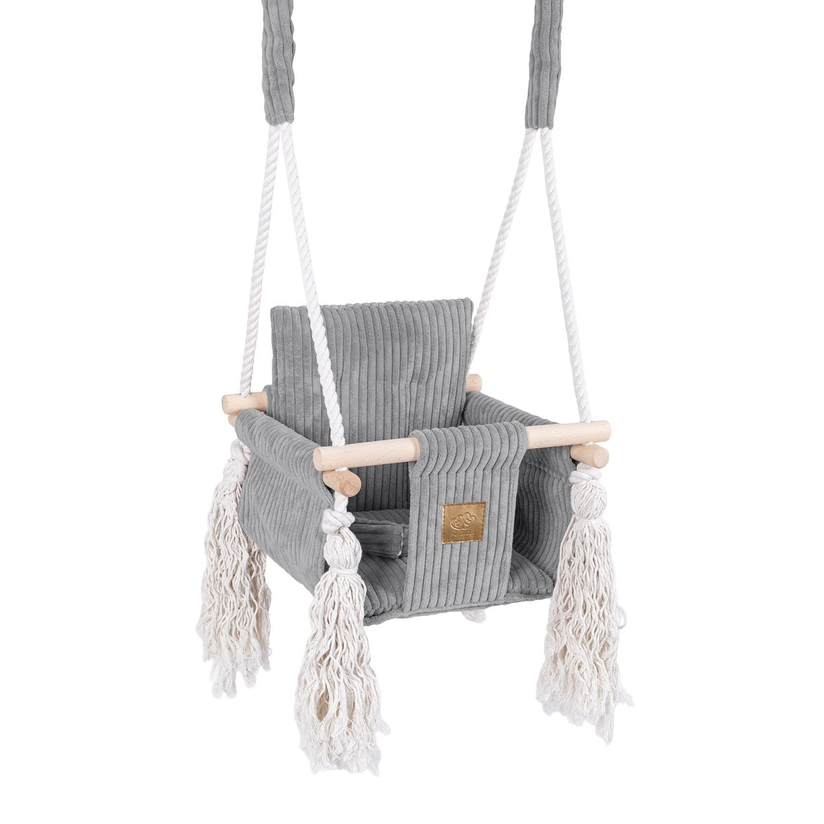 1. Grey corduroy indoor baby swing with wooden elements and decorative fringes, featuring sturdy cotton ropes and a cushioned seat, ideal for modern living spaces