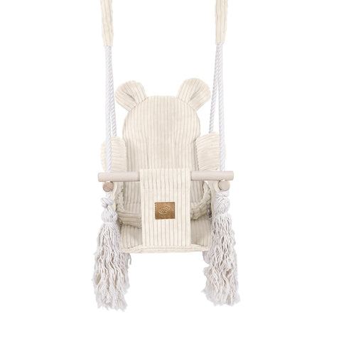 2. Front view of ecru indoor baby swing with teddy bear ears, soft corduroy fabric, and wooden elements, displayed in a studio