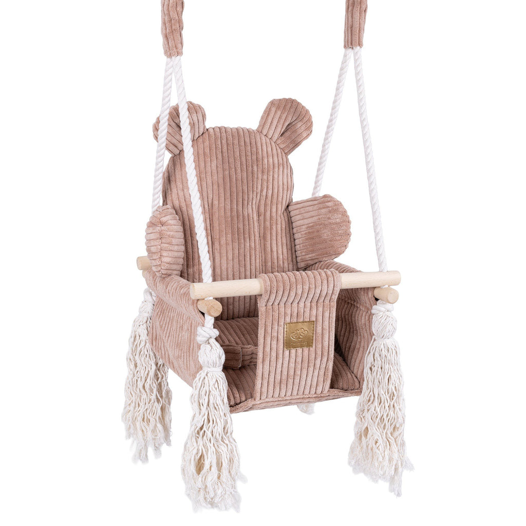 1. Pink powder teddy bear-themed indoor baby swing with corduroy seat, wooden base, and decorative fringes, designed for safety and comfort.