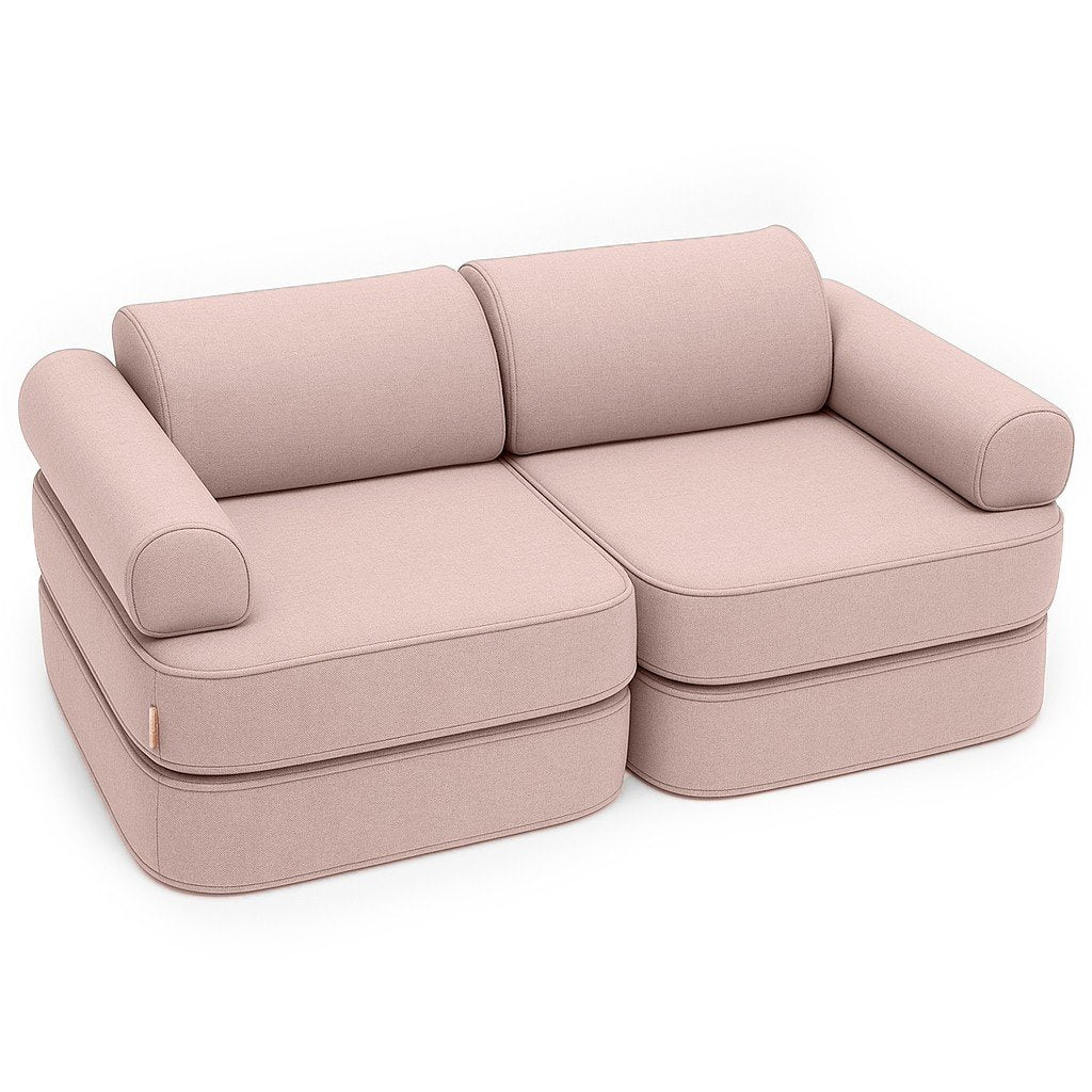 1. Children's modular sofa in rosy dune pink with two double mattresses, two headrests, and two armrests, shown in a studio setting