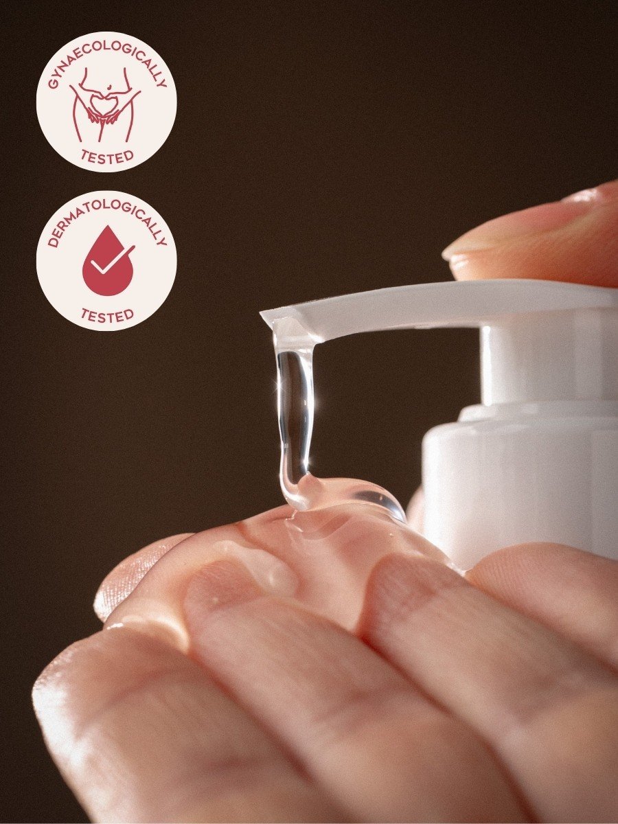 3. Close-up of Magrada Organic Cosmetics intimate wash gel being dispensed onto hand, showing clear gel texture and dermatologically tested label