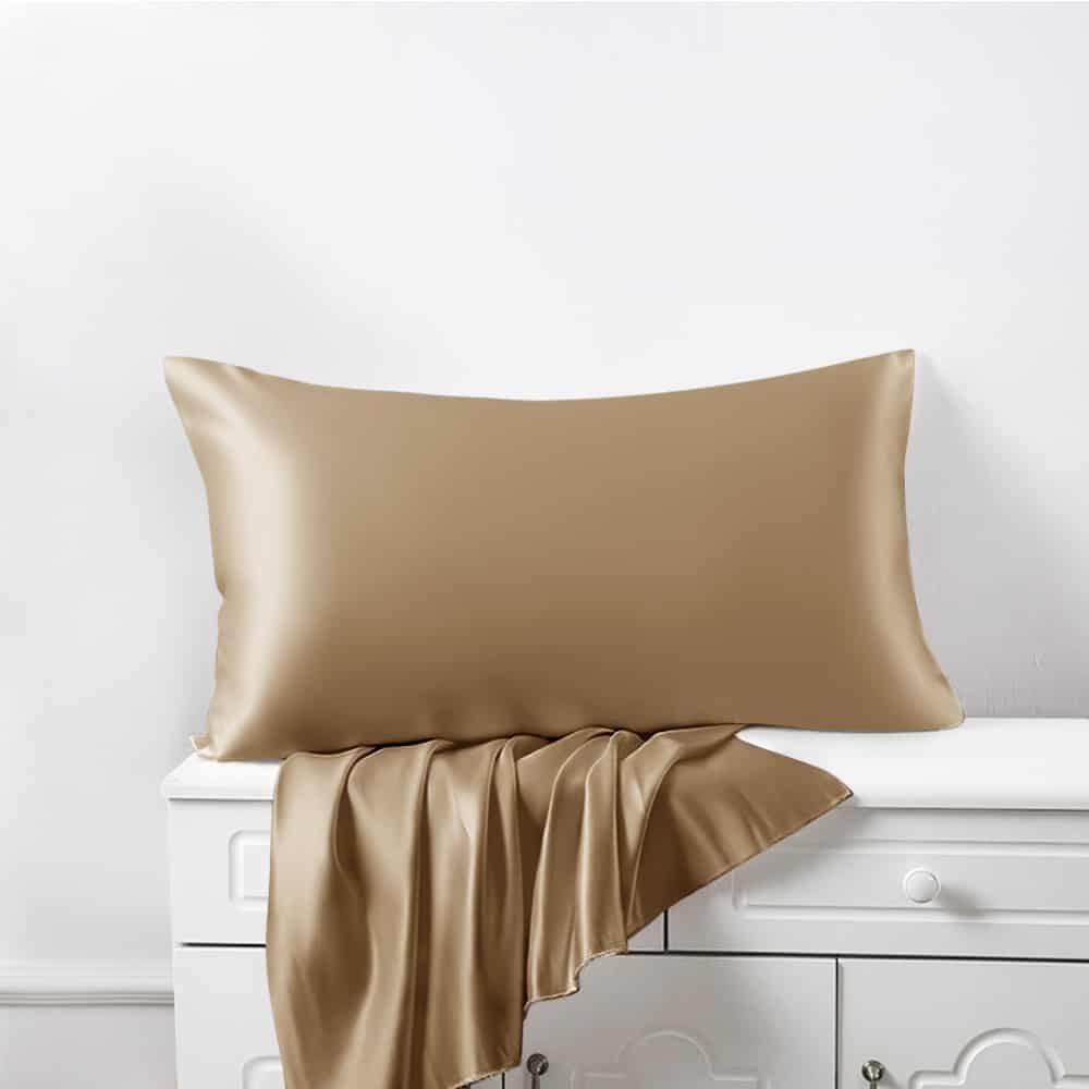 12. Cappuccino Mulberry silk pillowcase with draped fabric on a dresser, highlighting luxury