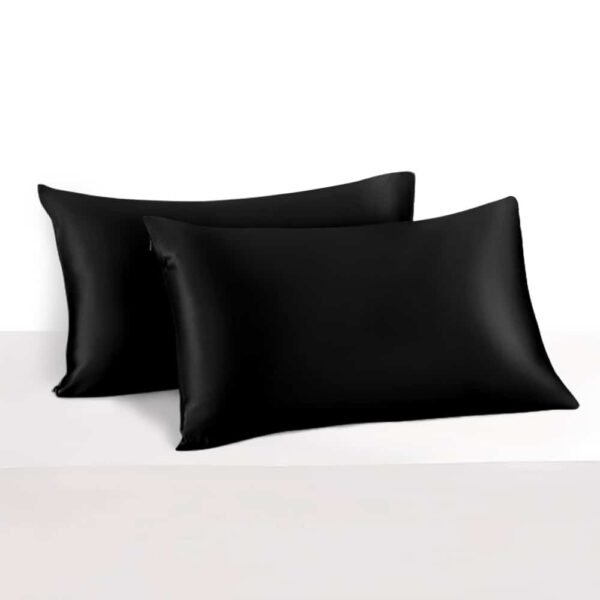 2. Pair of black Mulberry silk pillowcases on a white surface, highlighting smooth finish