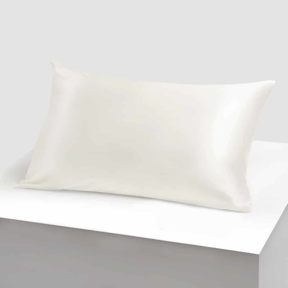 28. Single white silk pillowcase on white background, highlighting elegant design