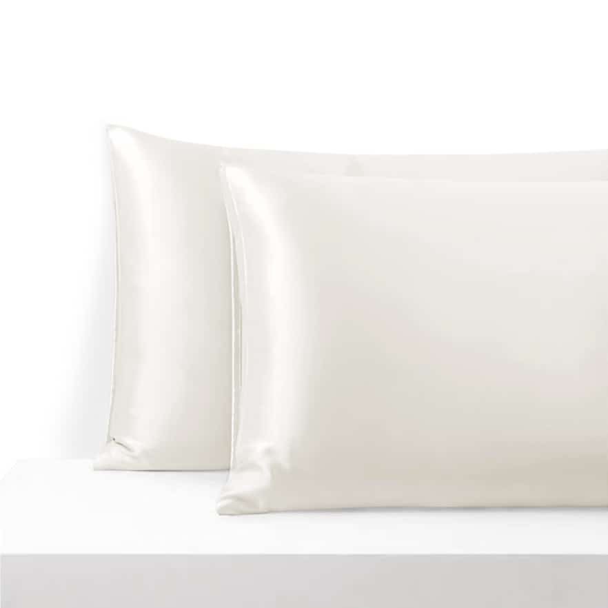 29. Pair of white silk pillowcases on white background, showcasing luxurious sheen