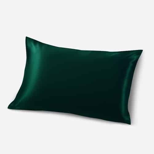 19. Green Mulberry silk pillowcase on a white platform, showcasing rich color