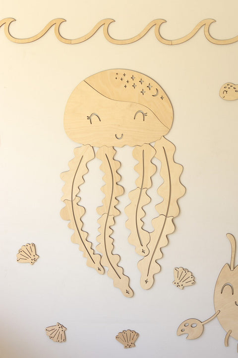 4. Wooden jellyfish wall decoration with smiling face and star details on white wall