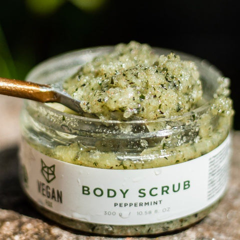 5. Open jar of Vegan Fox Peppermint Body Scrub with spoon, showing exfoliating texture