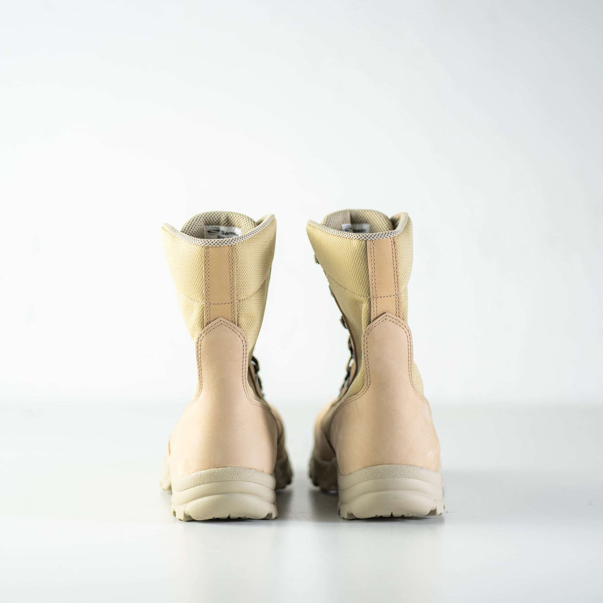 6. Back view of beige Samelin 598 Desert Boots in studio, showing heel and sole design