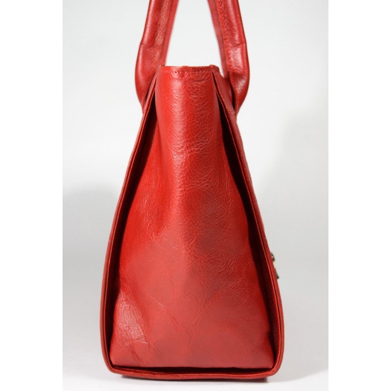 2. Side view of Papillon Leather Handbag No. 35-29 in cognac, showing texture and handle