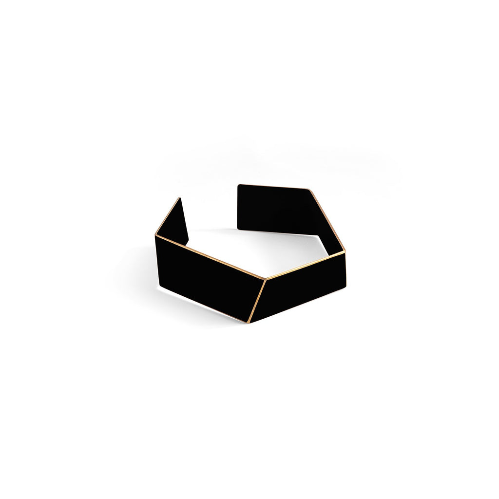 2. Black Lisa Kroeber Jewellery Folded Bracelet in studio setting, highlighting powder-coated brass material