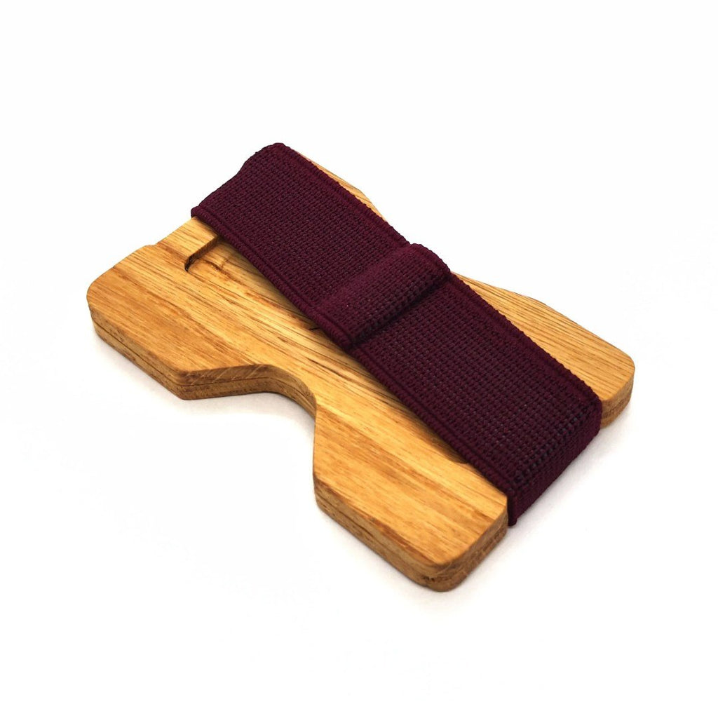 5. Side view of oak card holder with purple elastic band by Seif Design, showing thickness and texture
