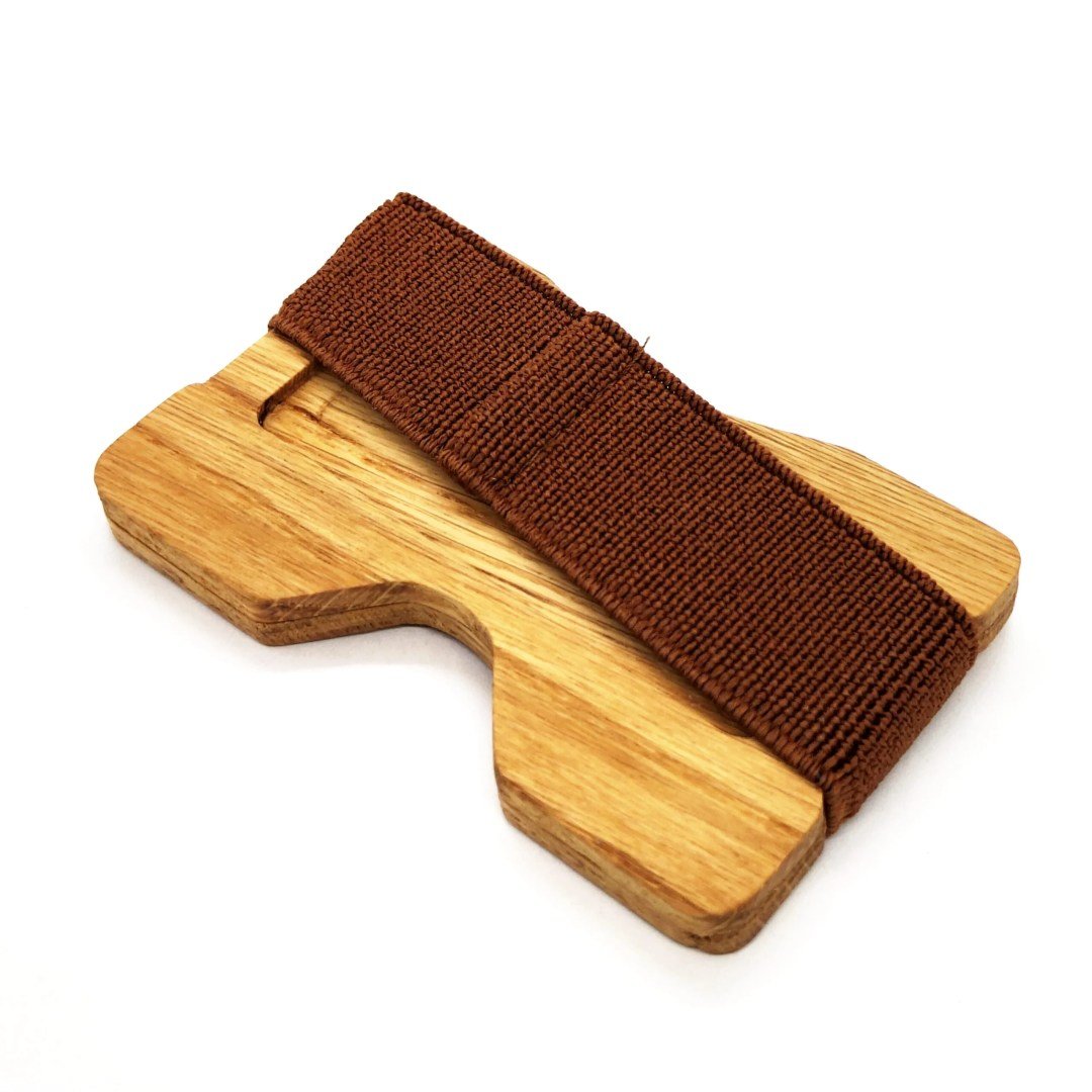 4. Side view of oak card holder with brown elastic band by Seif Design, highlighting thickness and texture