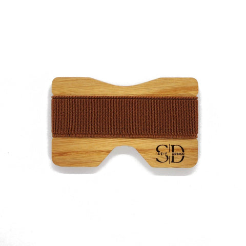 3. Oak card holder with brown elastic band by Seif Design, showcasing minimalist design and RFID blocking, studio shot