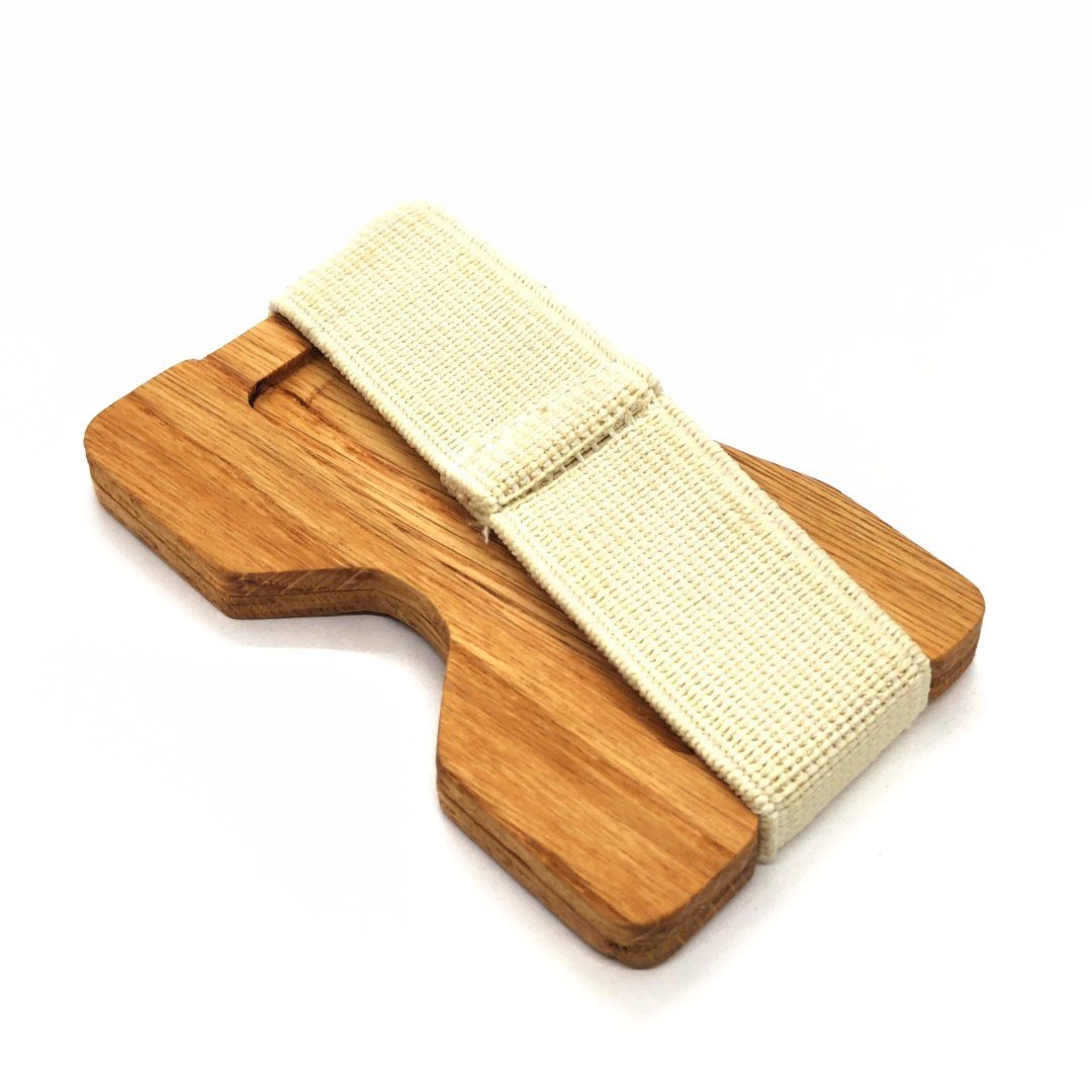6. Side view of oak card holder with white elastic band by Seif Design, emphasizing thickness and texture