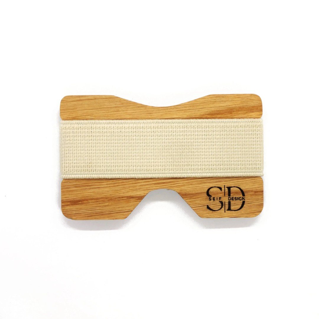 1. Oak card holder with white elastic band by Seif Design, featuring minimalist design and RFID blocking, studio shot