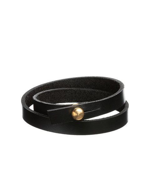 3. Black leather wristband by Stella Soomlais with gold screw button, shown in studio lighting highlighting double wrap design